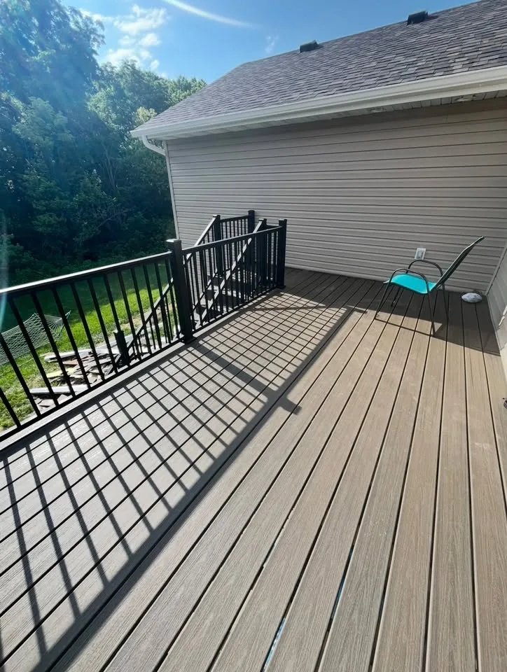Bright Side deck project with dark railings and a finished landing