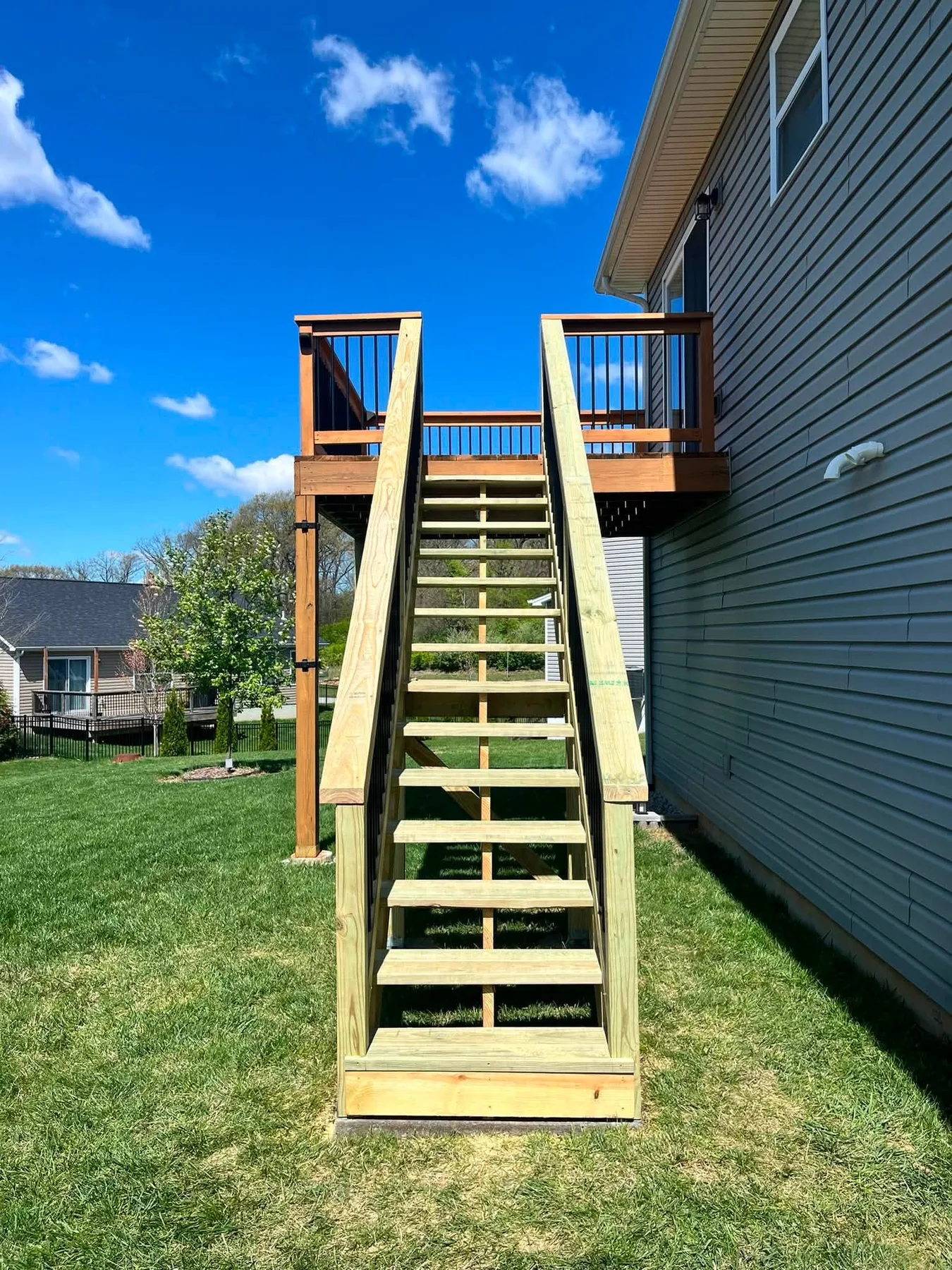 Rebuilt wood exterior stairs with matching railings